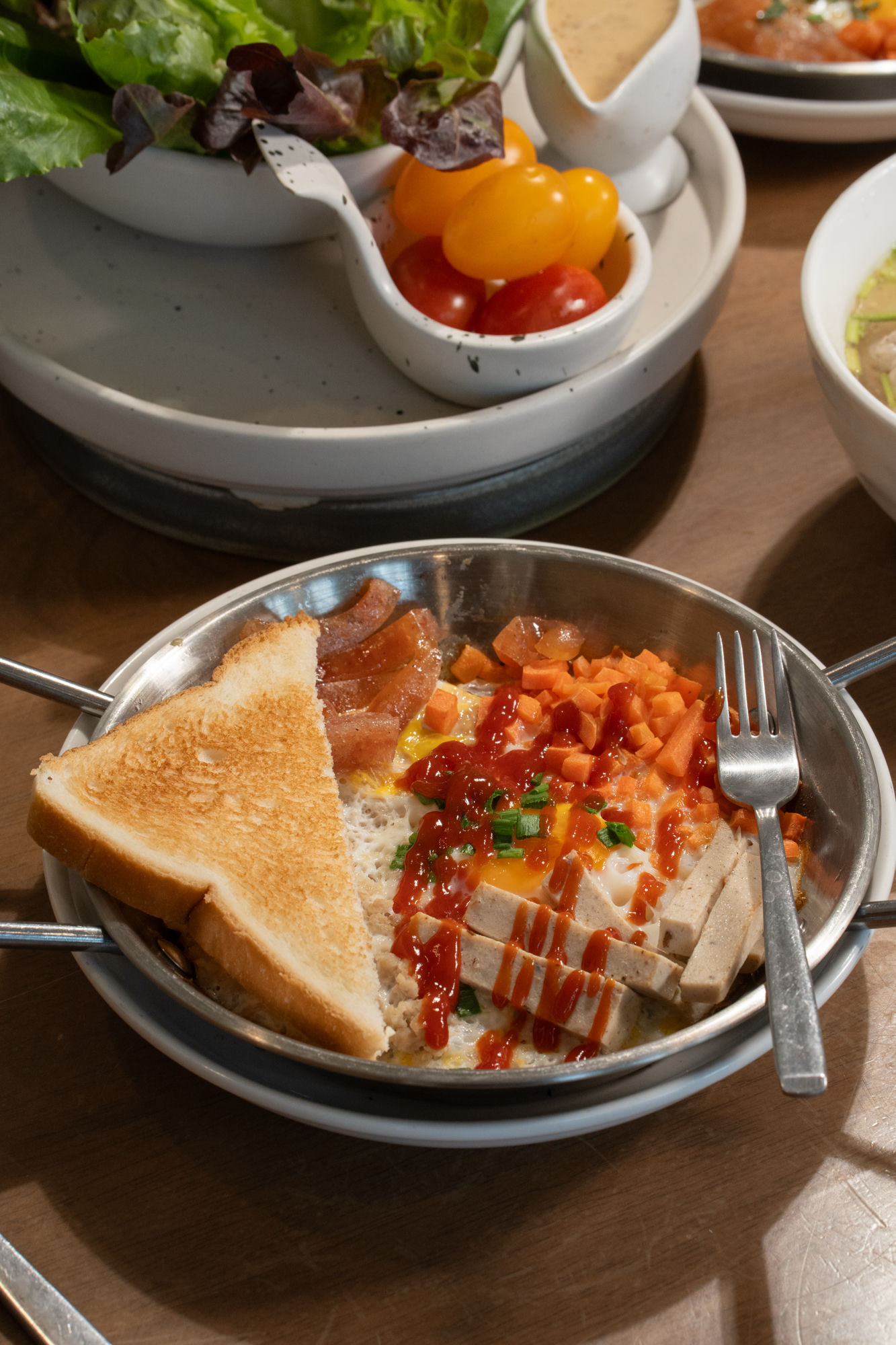 Close-up of pan breakfast with eggs, bacon and toast
