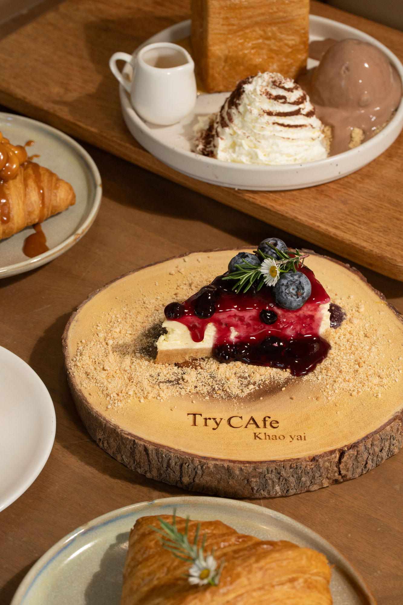 Blueberry cheesecake on wooden tray, Try Cafe