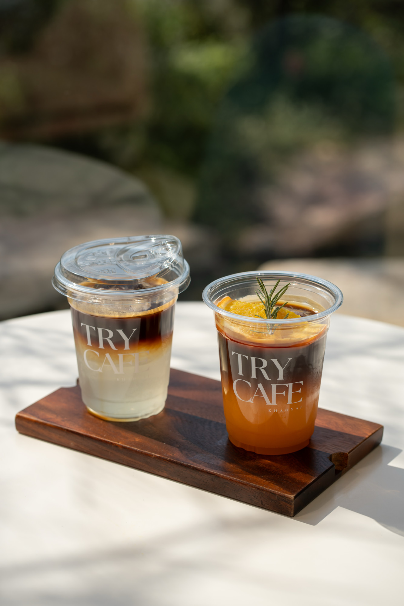 Iced Americano with orange slices on Try Cafe board