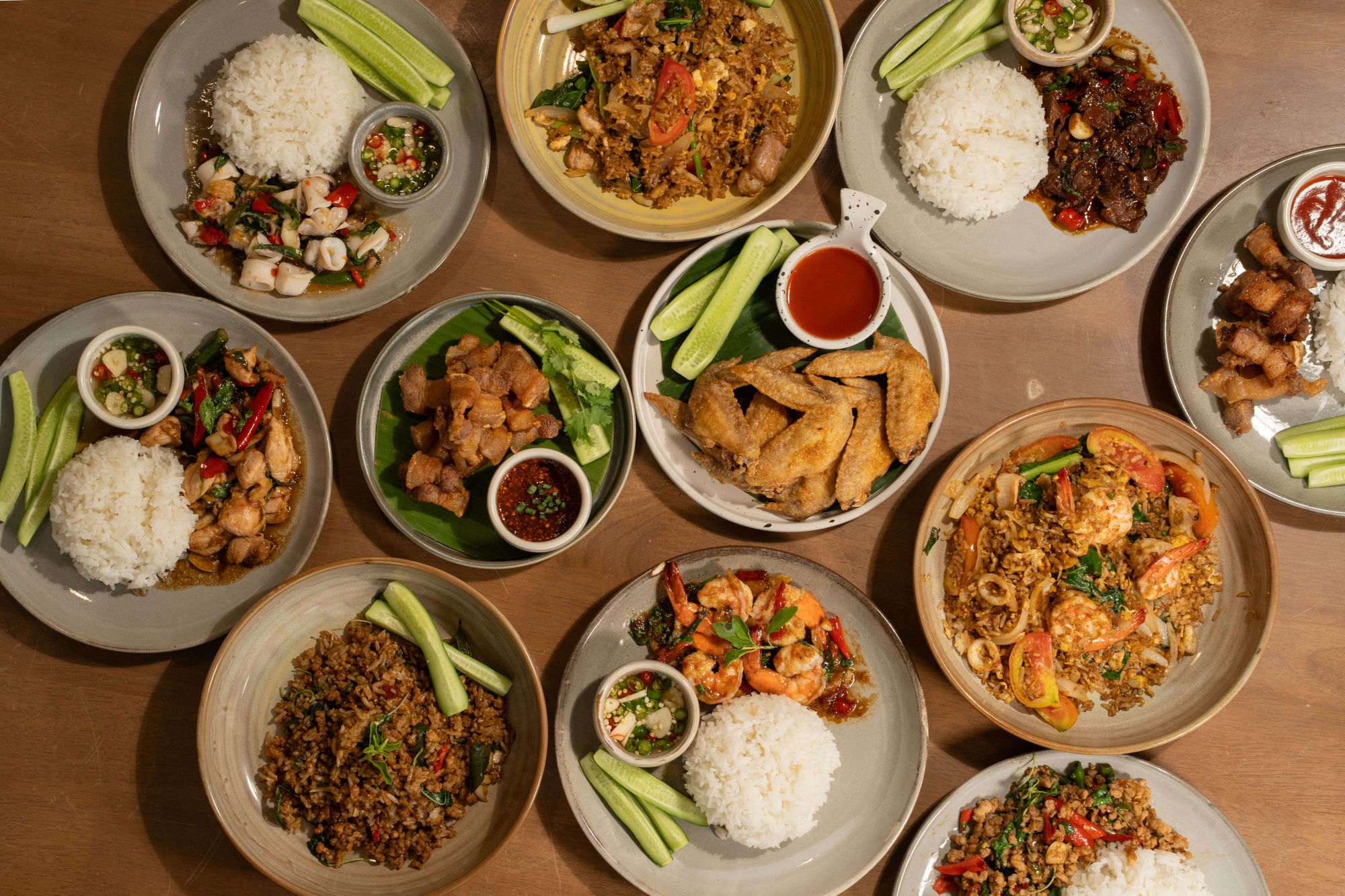 Top-down spread of Thai stir-fry rice dishes